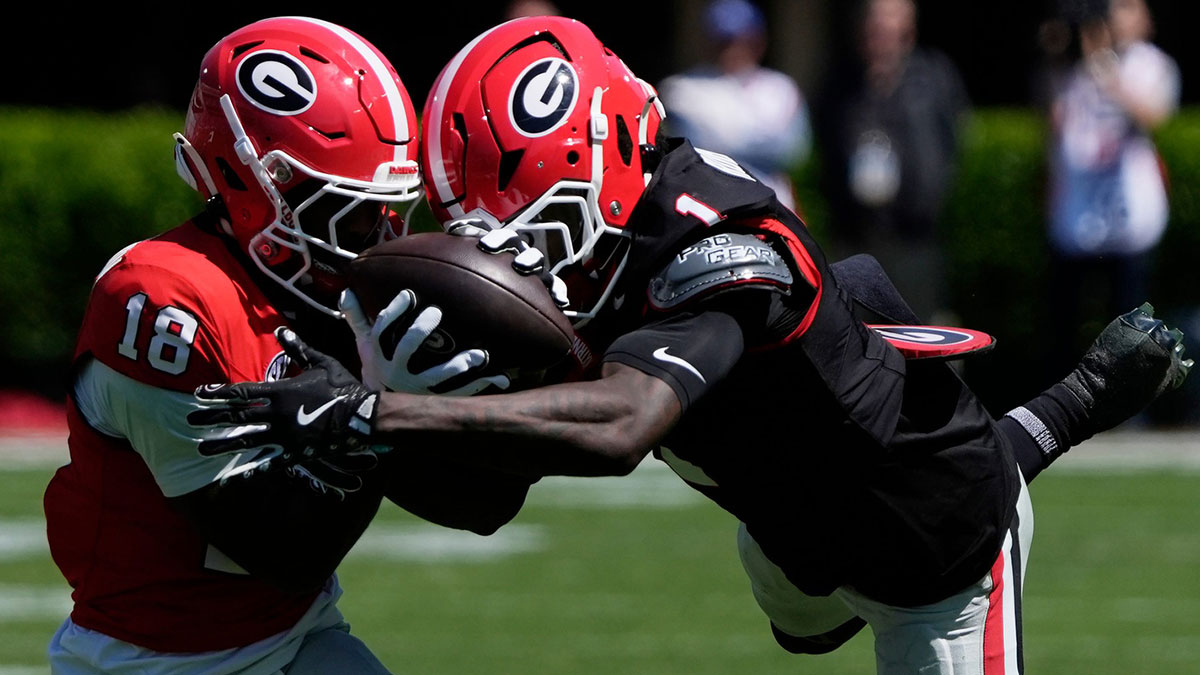 Georgia wide receiver Sacovie White (18) makes a catch while being defended by Georgia defensive back Ellis Robinson IV (1) during the Georgia G-Day spring football game in Athens, Ga., on Saturday, April 12, 2025.