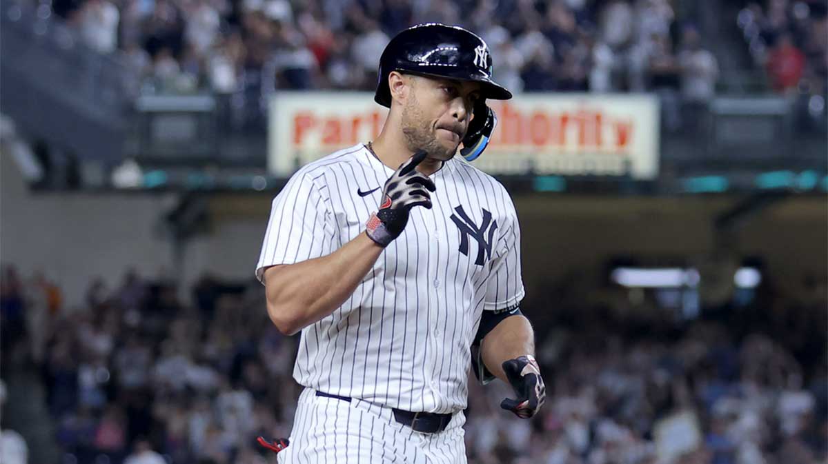 New York Yankees designated hitter Giancarlo Stanton (27) rounds the bases after hitting a two run home run against the Seattle Mariners during the eighth inning at Yankee Stadium.