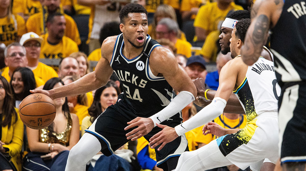 Milwaukee Bucks forward Giannis Antetokounmpo (34) dribbles the ball while Indiana Pacers forward Jarace Walker (5) defends during game five of the first round for the 2024 NBA Playoffs at Gainbridge Fieldhouse.