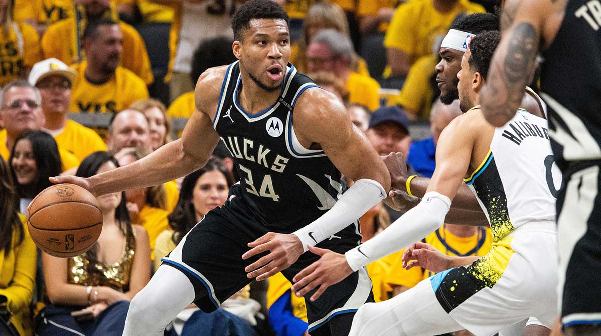 Milwaukee Bucks forward Giannis Antetokounmpo (34) dribbles the ball while Indiana Pacers forward Jarace Walker (5) defends during game five of the first round for the 2024 NBA Playoffs at Gainbridge Fieldhouse.