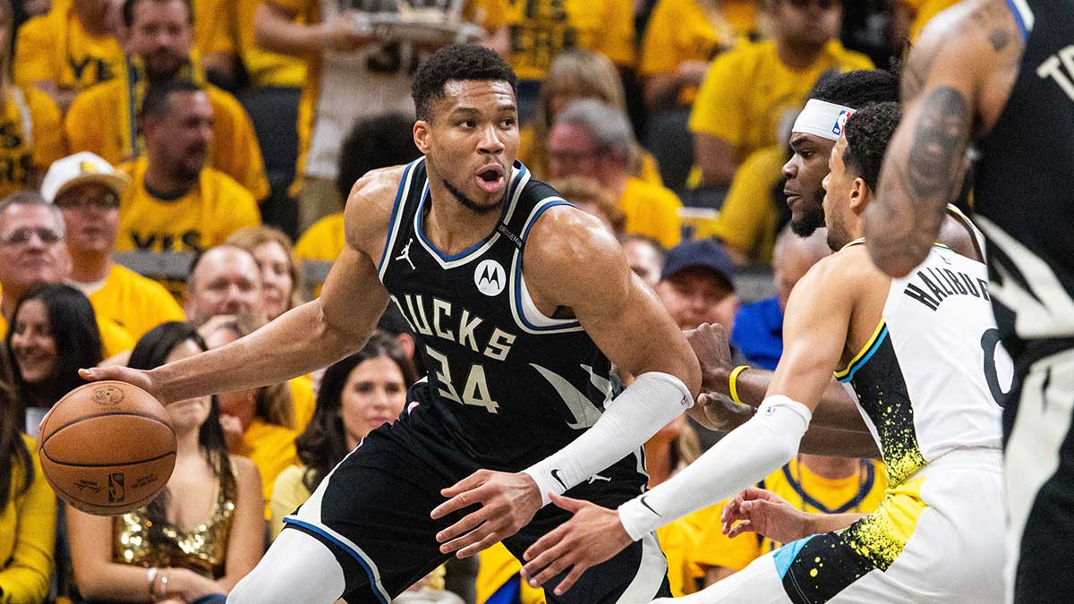 Milwaukee Bucks forward Giannis Antetokounmpo (34) dribbles the ball while Indiana Pacers forward Jarace Walker (5) defends during game five of the first round for the 2024 NBA Playoffs at Gainbridge Fieldhouse.