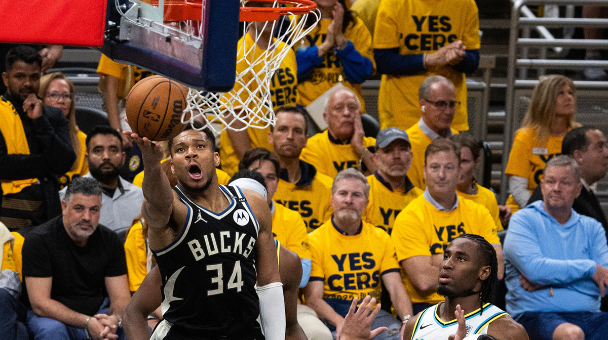 Milwaukee Bucks forward Giannis Antetokounmpo (34) shoots the ball while Indiana Pacers guard Andrew Nembhard (2) defends during game five of the first round for the 2024 NBA Playoffs at Gainbridge Fieldhouse.