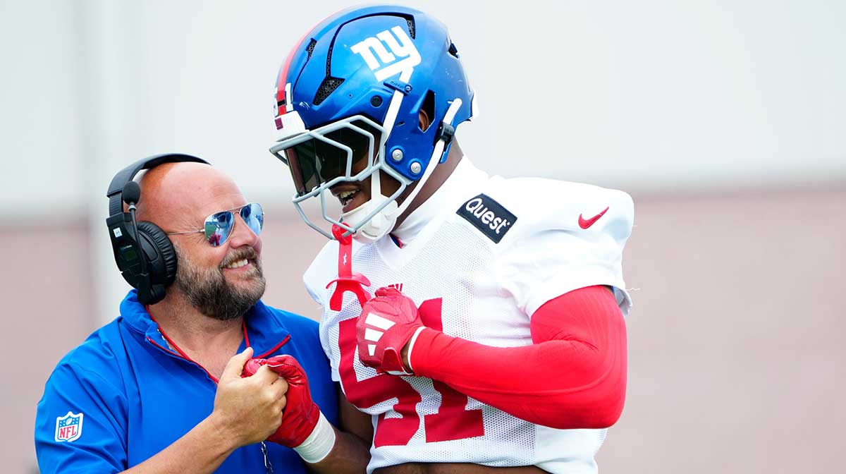 Giants Head Coach, Brian Daboll is shown beside New York Giants linebacker Abdul Carter (51), Sunday, July 27, 2025, in East Rutherford.