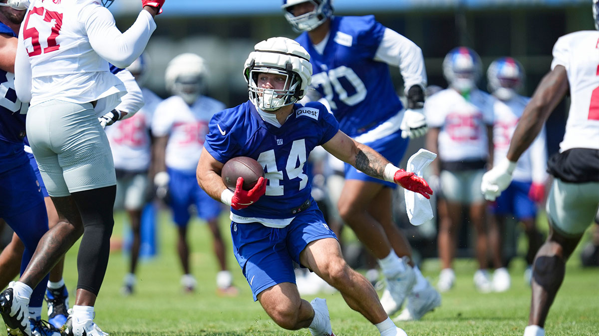 New York Giants running back Cam Skattebo (44) runs the ball on day two of training camp at Quest Diagnostics Giants Training Center.
