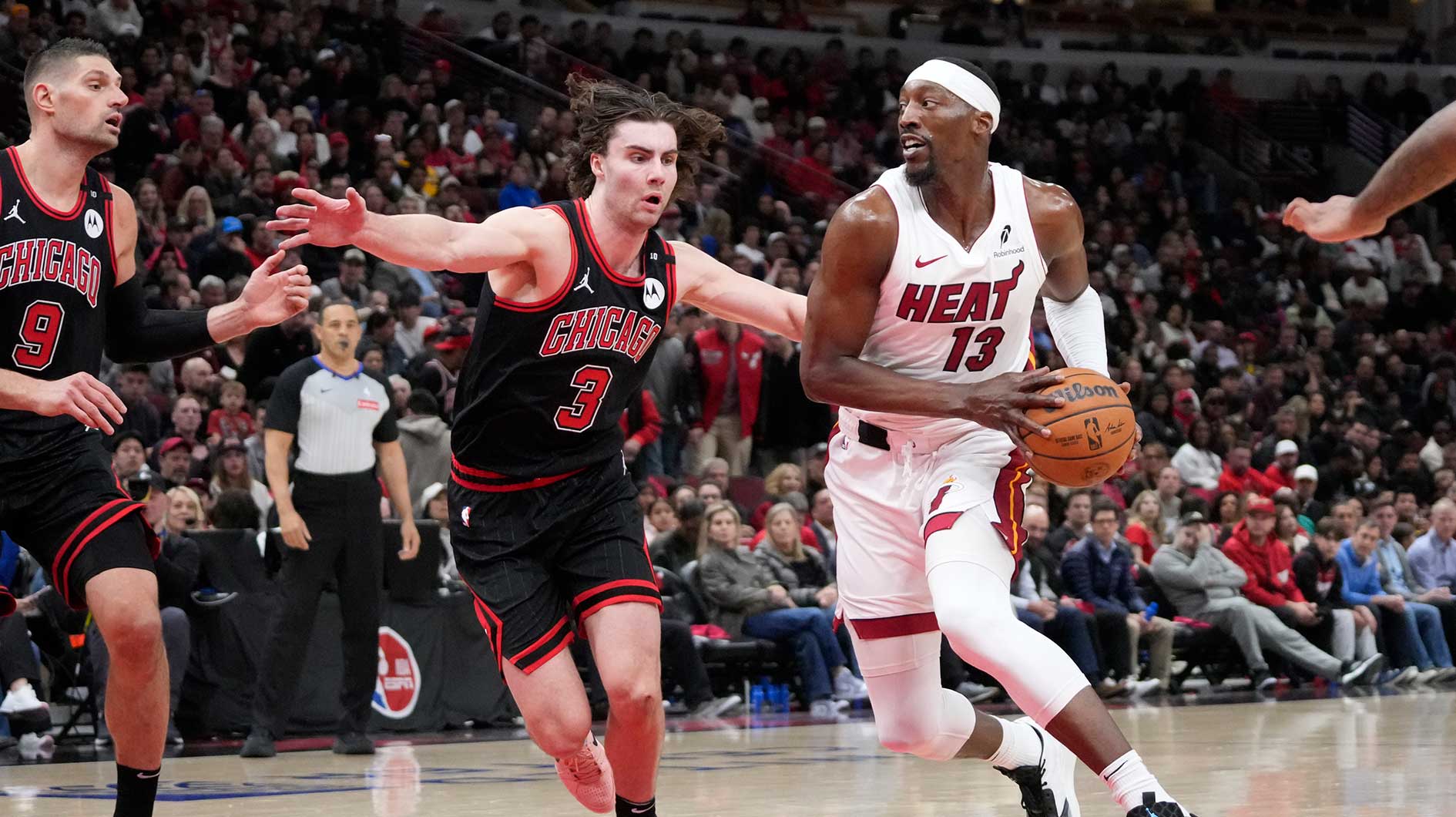 Chicago Bulls guard Josh Giddey (3) defends Miami Heat center Bam Adebayo (13) during the second half at United Center.
