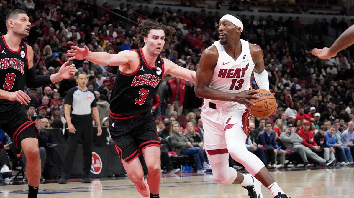 Chicago Bulls guard Josh Giddey (3) defends Miami Heat center Bam Adebayo (13) during the second half at United Center.