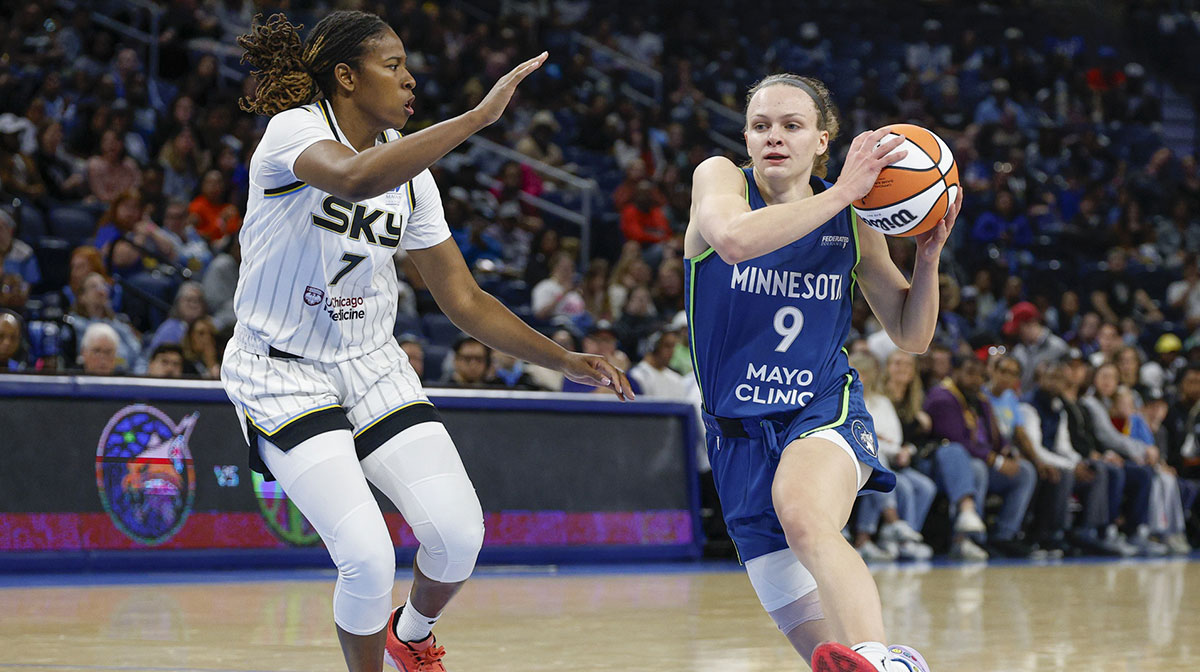 Minnesota Lynx guard Grace Berger (9) drives to the basket against Chicago Sky guard Ariel Atkins (7) during the first half of a WNBA pre-season game at Wintrust Arena.