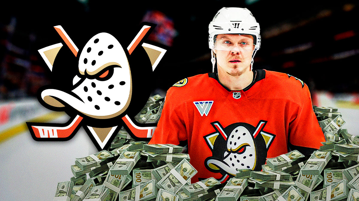 Mikael Granlund in a ducks jersey, money around him, Ducks logo in the background.