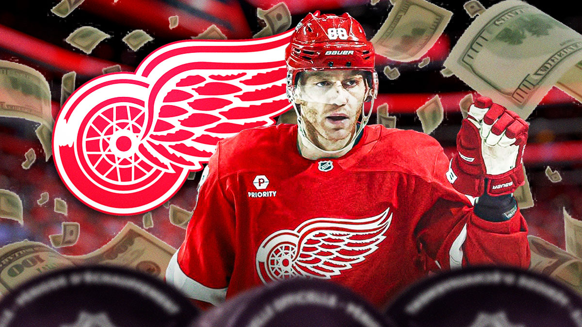 Patrick Kane with money around him and the Red Wings logo in the background.