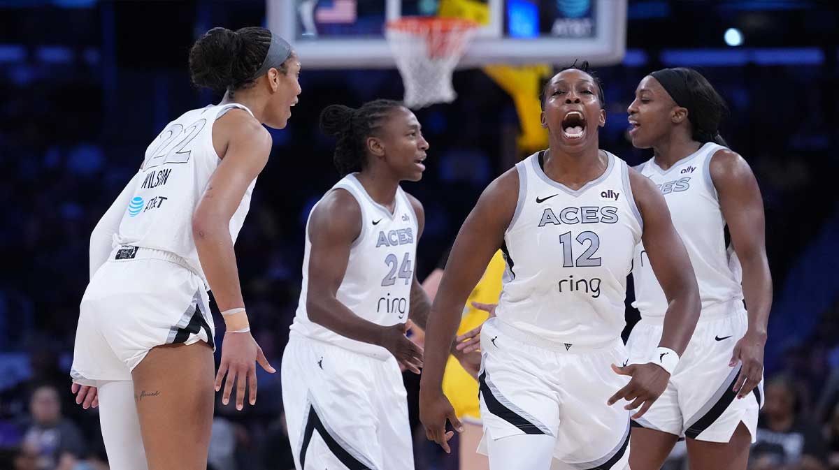 Las Vegas Aces center A'ja Wilson (22) and guard Chelsea Gray (12) celebrate in the first half against the LA Sparks at Crypto.com Arena.