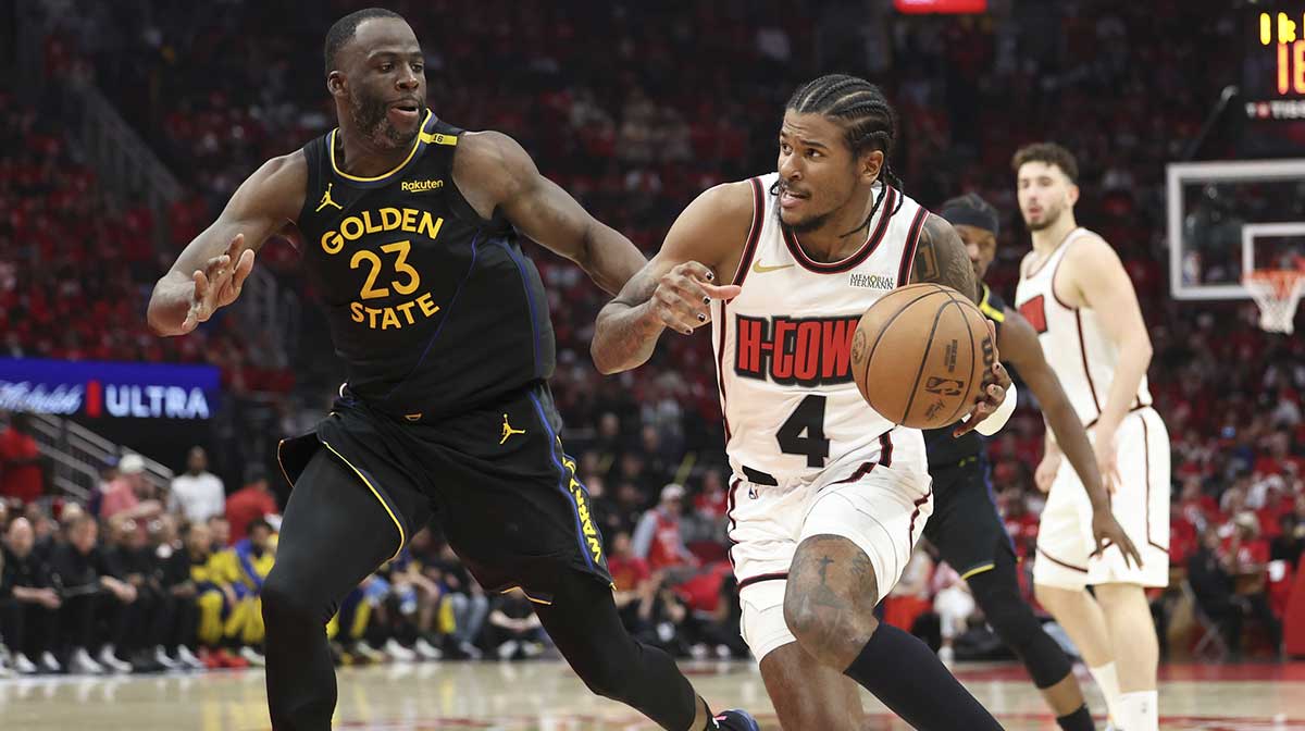 Houston Rockets guard Jalen Green (4) drives with the ball as Golden State Warriors forward Draymond Green (23) defends during game seven of the first round for the 2025 NBA Playoffs at Toyota Center.