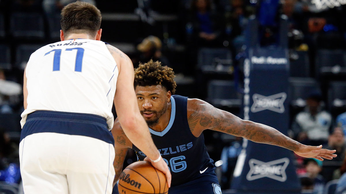 Memphis Grizzlies guard Marcus Smart (36) defends Dallas Mavericks guard Luka Doncic (77) during the second half at FedExForum.