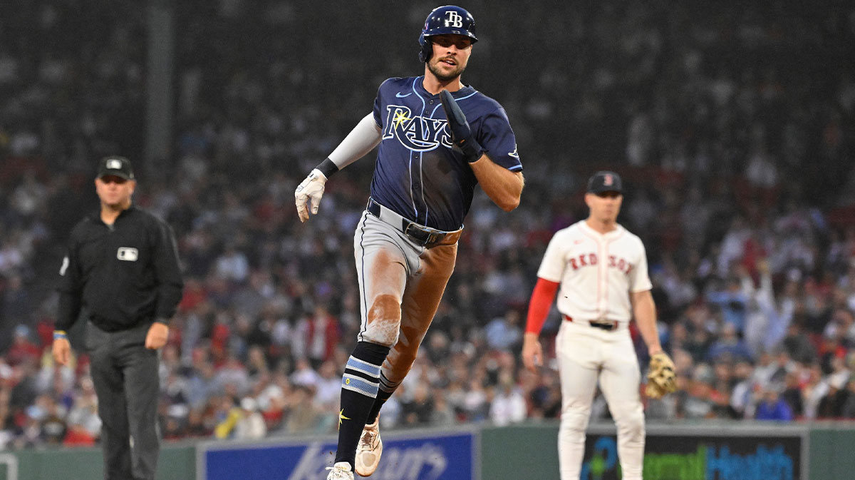 Tampa Bay Rays right fielder Josh Lowe (15) scores a run off a two run home run by shortstop Ha-Seong Kim (7) (not pictured) during the fourth inning against the Boston Red Sox at Fenway Park.