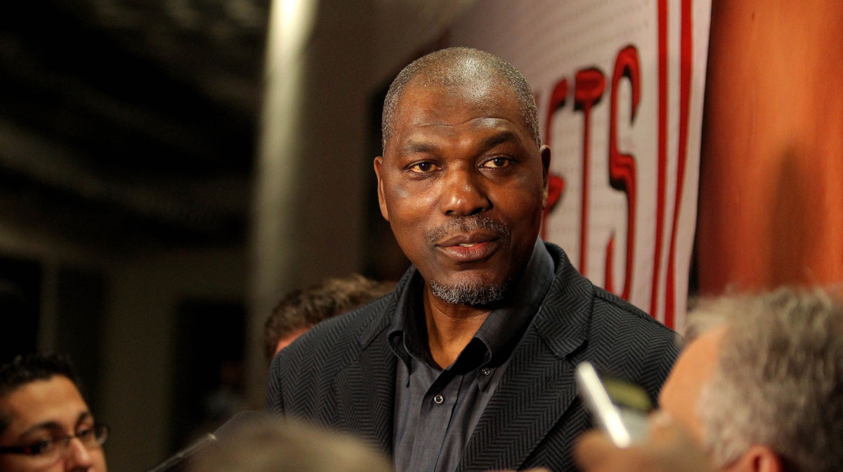 Former Houston Rocket center Hakeem Olajuwon speaks to reporters prior to the game between the Houston Rockets and the Orlando Magic at Toyota Center.