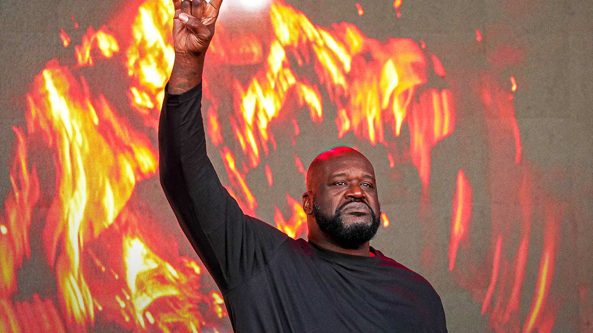 Shaquille O'Neal holds up the sign of the horns during a DJ performance ahead of the College Football Playoff semifinal game between the Texas Longhorns and Ohio State in the Cotton Bowl at AT&T Stadium on Friday, Jan. 10, 2024 in Arlington, Texas.