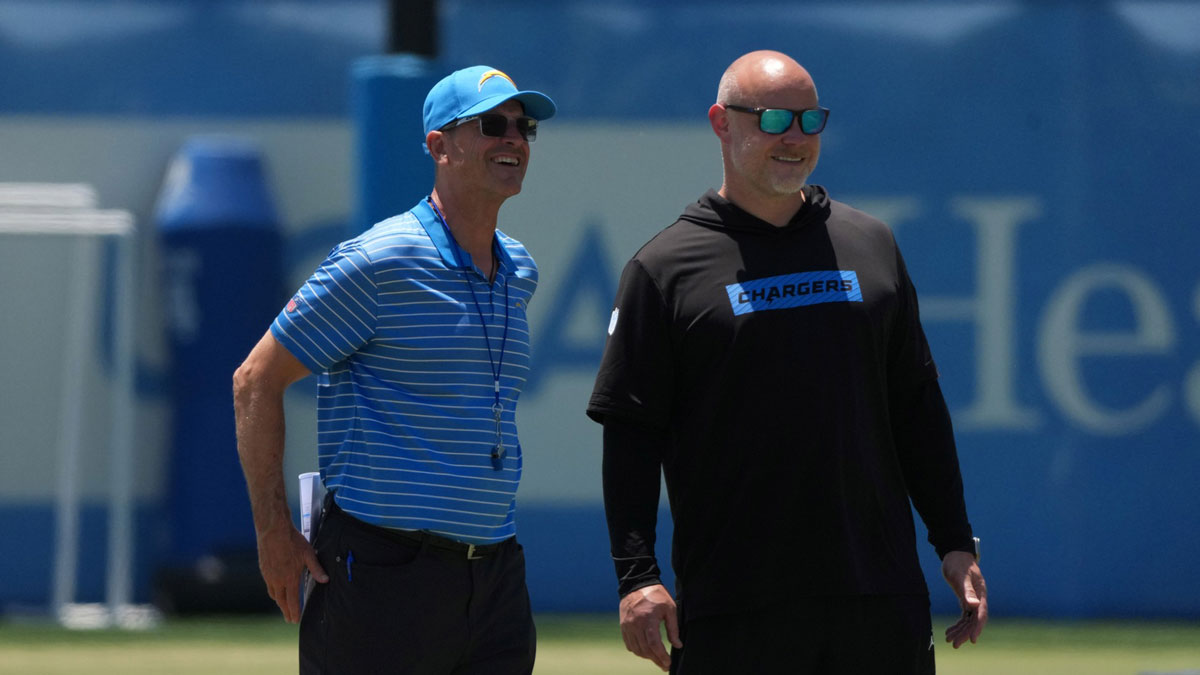 Los Angeles Chargers coach Jim Harbaugh (left) and executive director of player performance Ben Herbert during organized team activities at The Bolt.