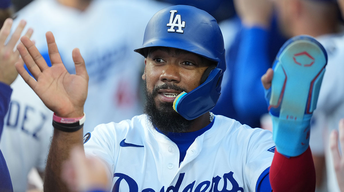 Los Angeles Dodgers right fielder Teoscar Hernández (37) celebrates scoring during the first inning against the Chicago White Sox at Dodger Stadium.