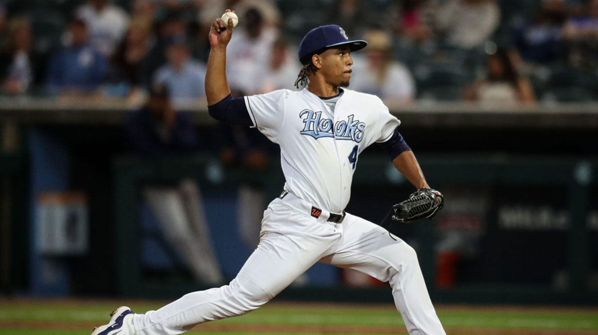 Hooks pitcher Miguel Ullola throws a pitch on Opening Night at Whataburger Field on Friday, April 5, 2024, in Corpus Christi, Texas.