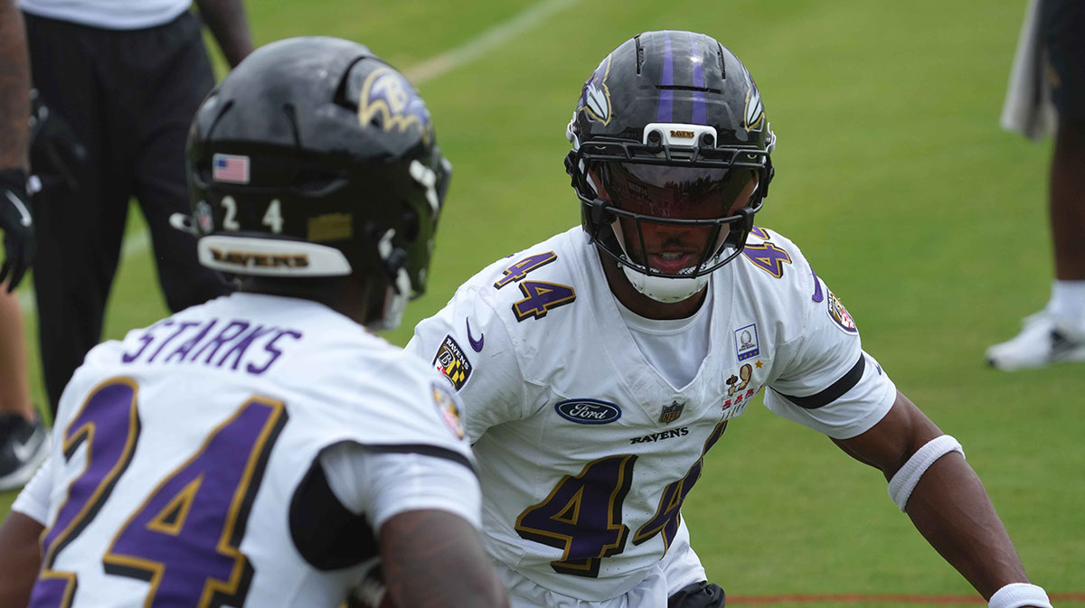 Baltimore Ravens cornerback Marlon Humphrey (44) and safety Malaki Starks (24) during training camp drills at the Under Armour Performance Center.