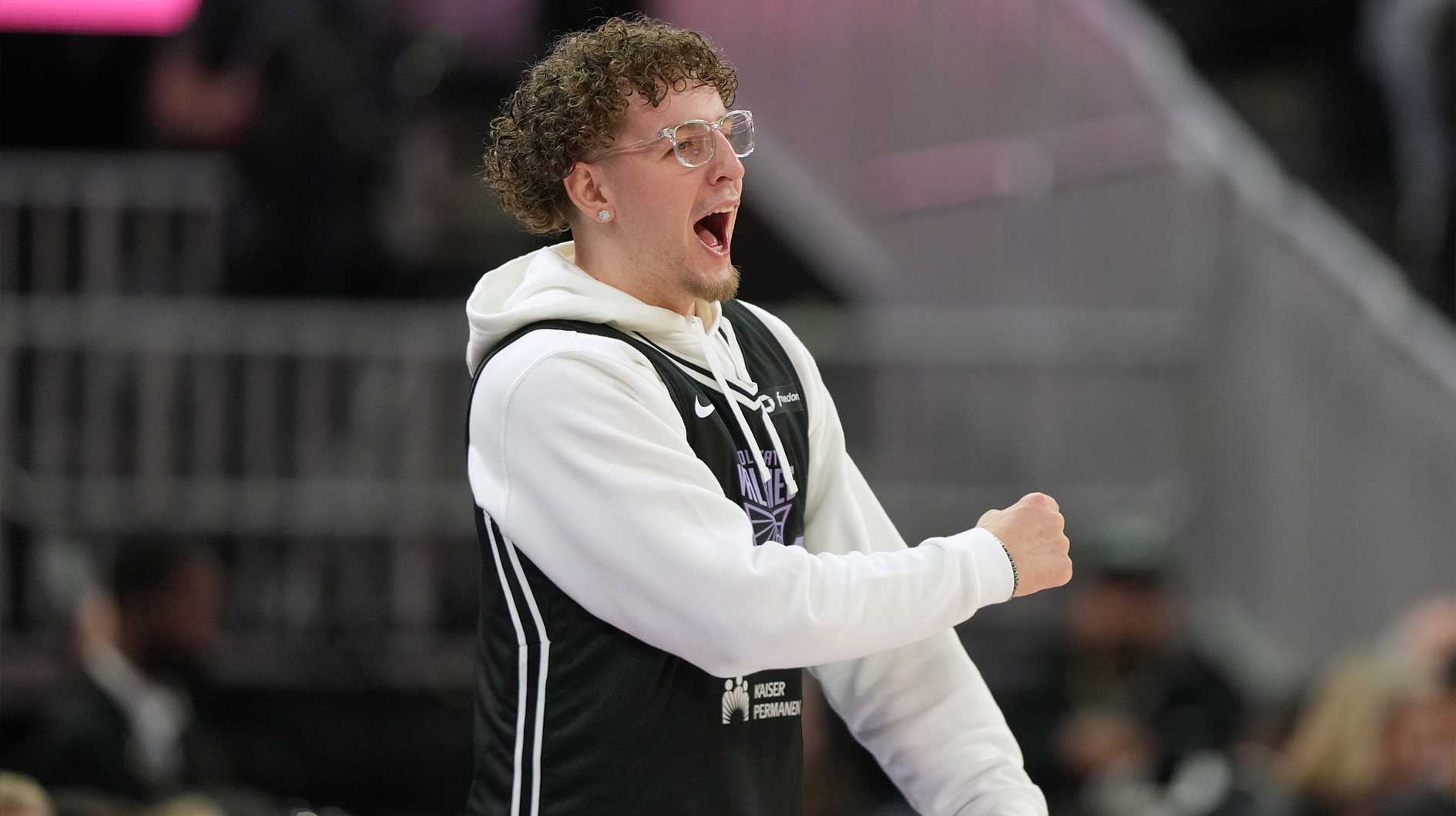 Golden State Warriors guard Brandin Podziemski cheers during the third quarter of the game between the Golden State Valkyries and the Seattle Storm at Chase Center.