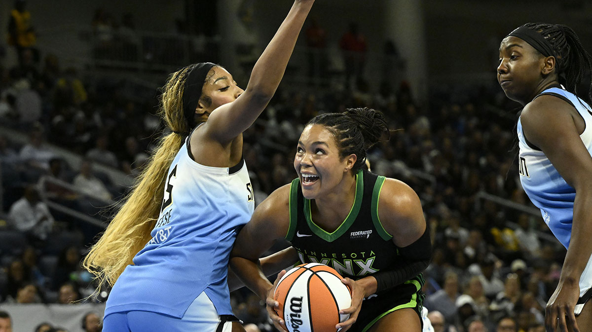Minnesota Lynx forward Napheesa Collier (24) drives to the basket against Chicago Sky forward Angel Reese (5) during the first half at Wintrust Arena.