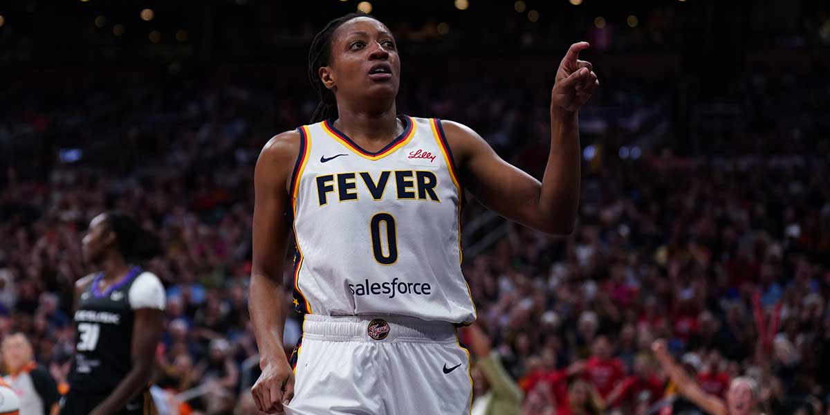 Indiana Fever guard Kelsey Mitchell (0) reacts after her basket and being fouled by the Connecticut Sun in the first quarter at TD Garden