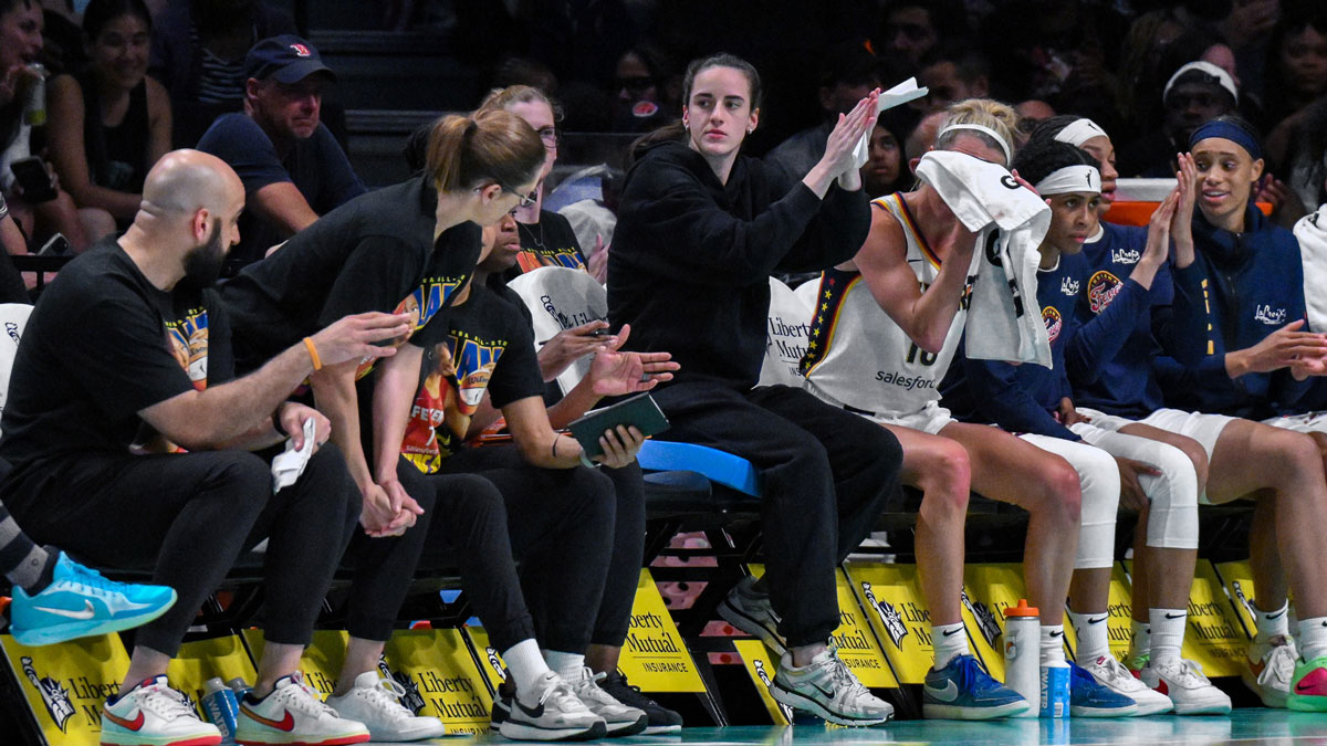 Indiana Fever guard Caitlin Clark (22) reacts from the bench during the first half against the New York Liberty at Barclays Center.