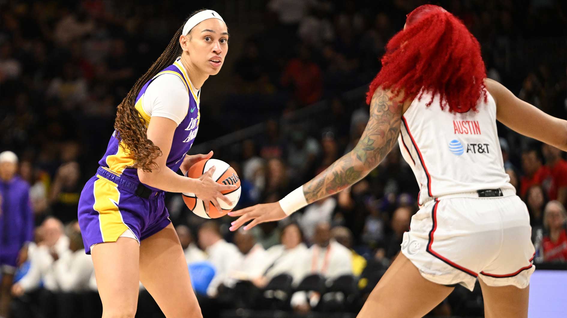 Los Angeles Sparks forward Dearica Hamby (5) looks to pass the ball in front of Washington Mystics forward Shakira Austin (0) during the first quarter at CareFirst Arena.