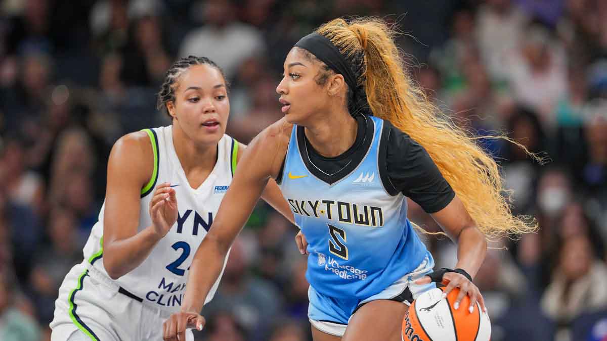 Chicago Sky forward Angel Reese (5) dribbles against the Minnesota Lynx forward Napheesa Collier (24) in the fourth quarter at Target Center.