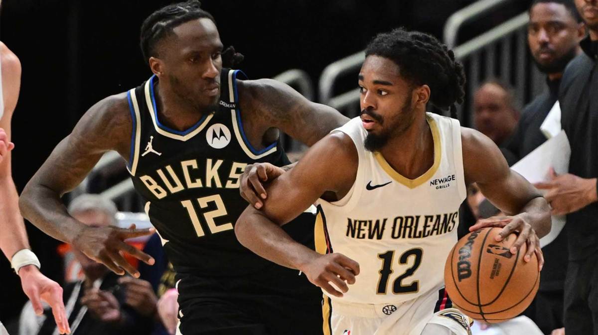 New Orleans Pelicans guard Antonio Reeves (12) looks for a shot against Milwaukee Bucks guard Taurean Prince (12) in the third quarter at Fiserv Forum.