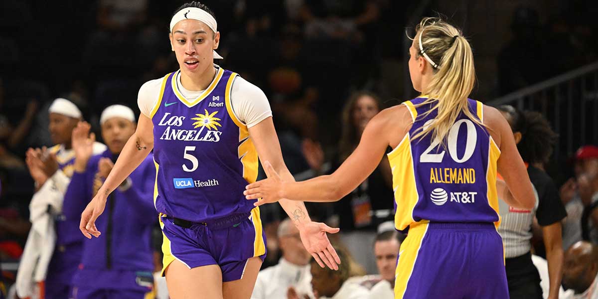 Los Angeles Sparks forward Dearica Hamby (5) celebrates a basket with guard Julie Allemand (20) against the Washington Mystics during the fourth quarter at CareFirst Arena.