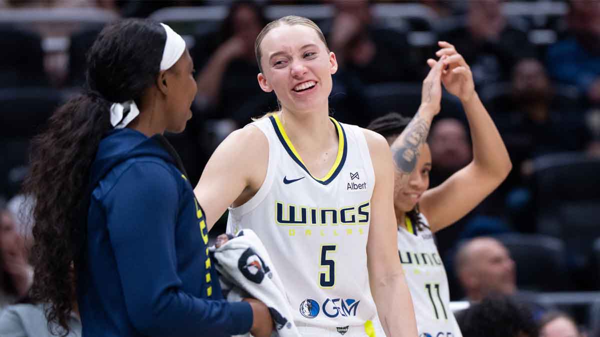 Dallas Wings guard Paige Bueckers (5) celebrates with teammates on the bench during the second half against the Seattle Storm at Climate Pledge Arena.