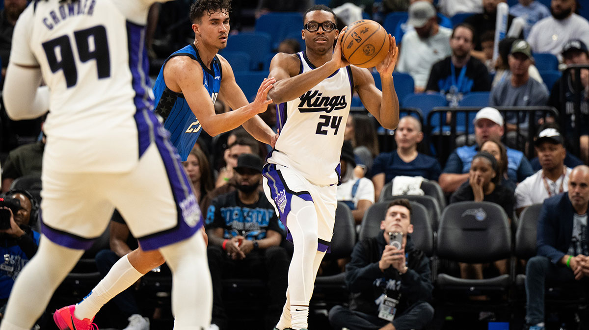 Sacramento Kings guard/forward Isaiah Crawford (24) passes the ball against Orlando Magic forward Tristan da Silva (23) in the fourth quarter at Kia Center.