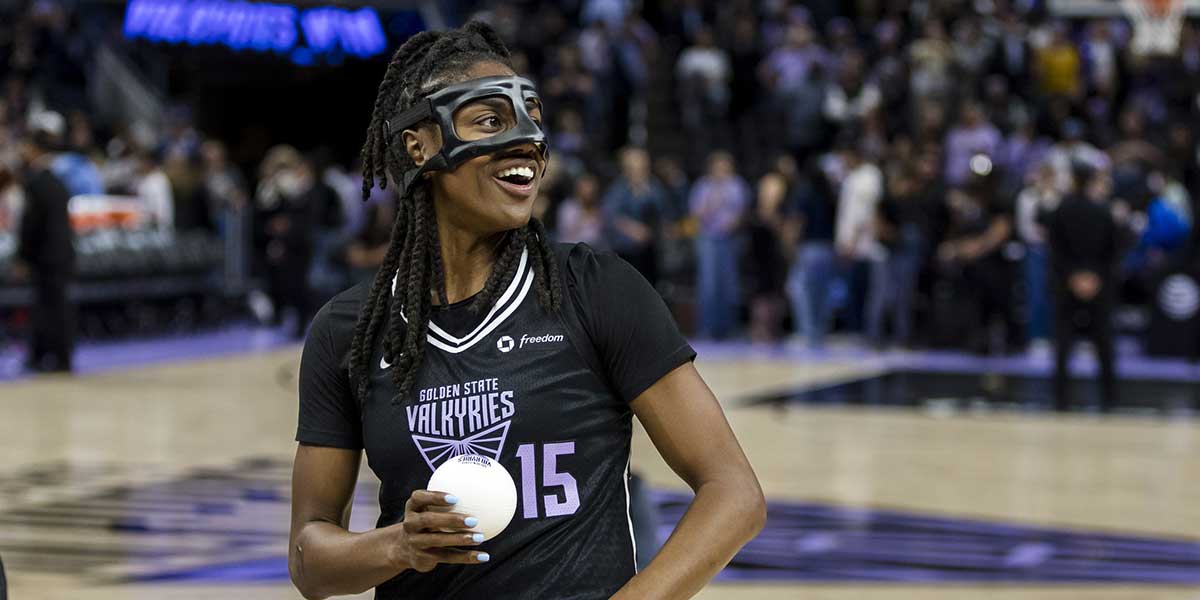 Golden State Valkyries guard Tiffany Hayes (15) prepares to throw a ball to fans after a game against the Dallas Wings at Chase Center.