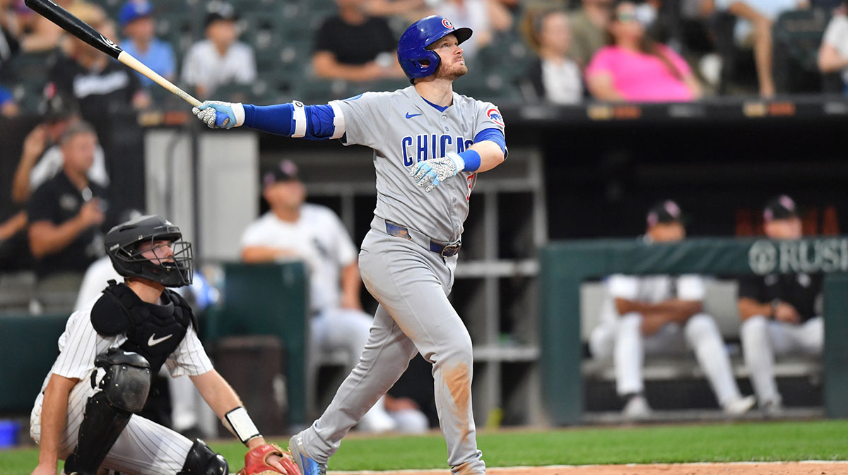 Chicago Cubs left fielder Ian Happ (8) hits a solo home run during the seventh inning against the Chicago White Sox at Rate Field.