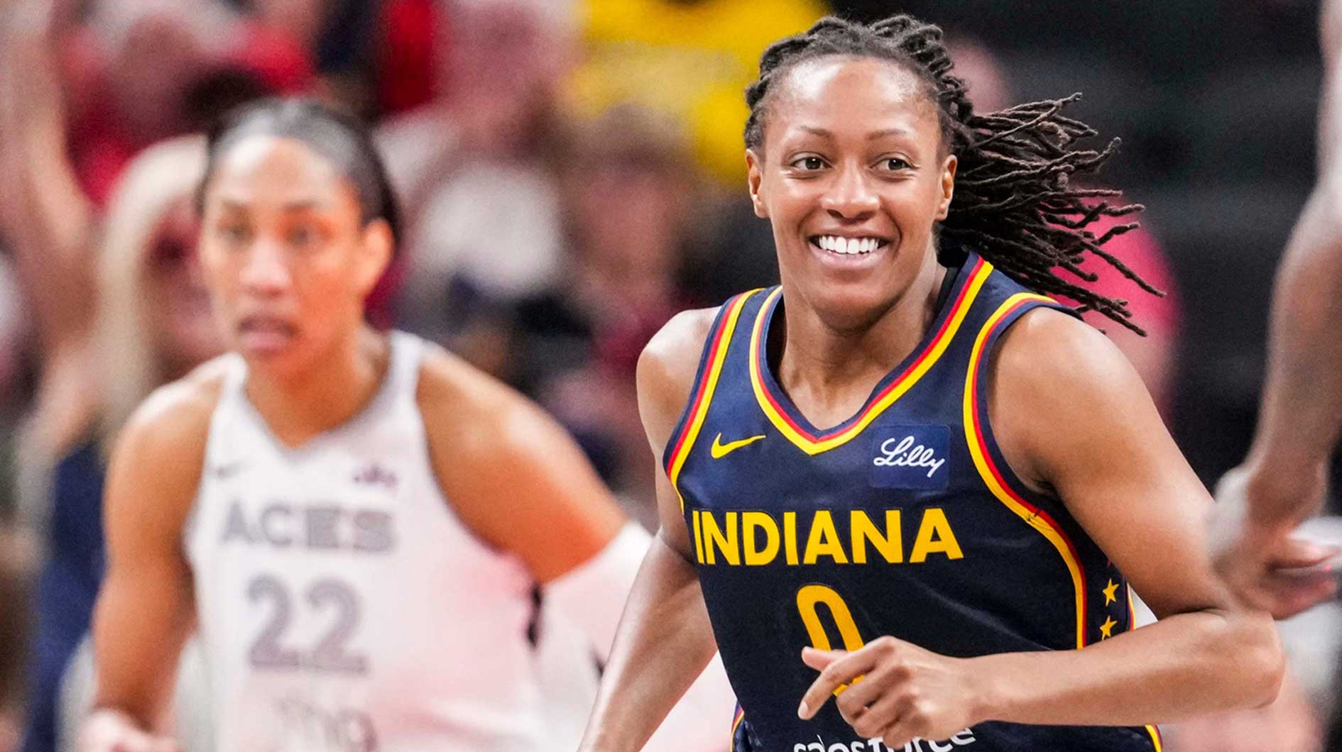 Indiana Fever guard Kelsey Mitchell (0) smiles after a play Thursday, July 3, 2025, during a game between the Indiana Fever and the Las Vegas Aces at Gainbridge Fieldhouse in Indianapolis.
