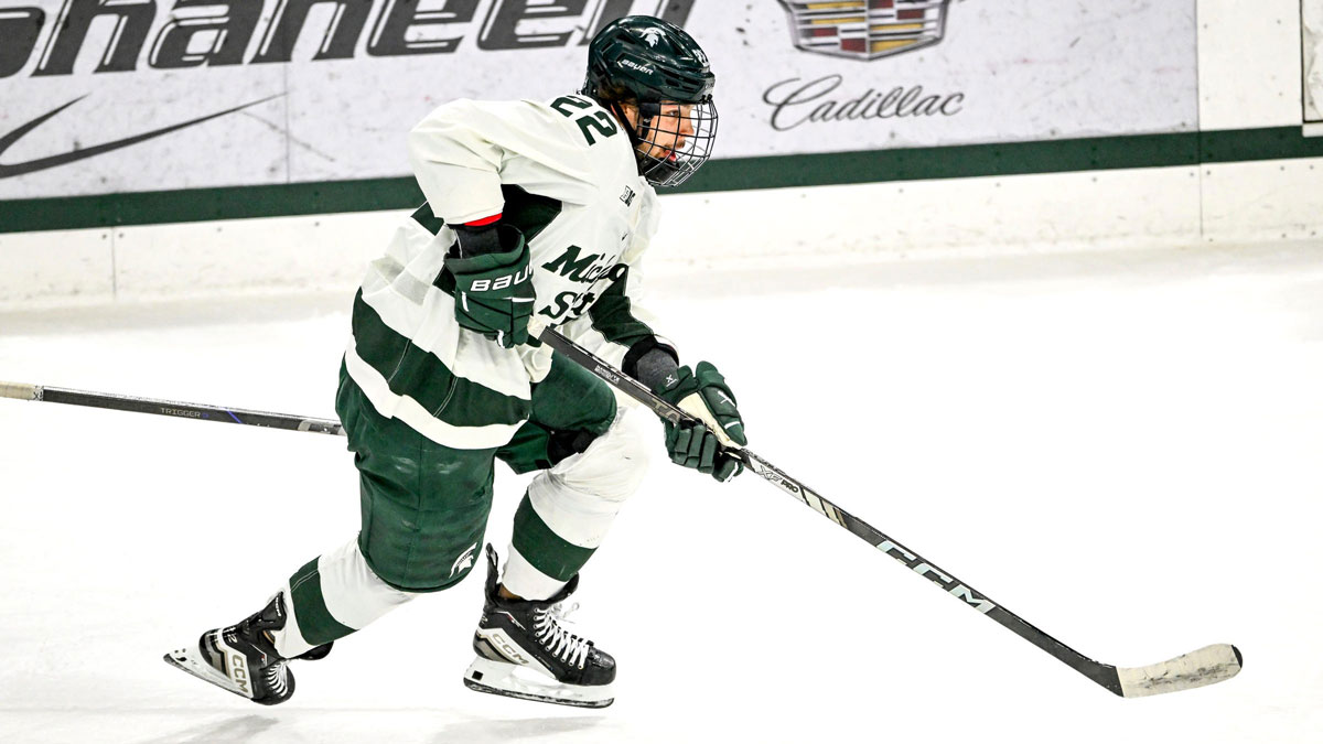 Michigan State's Isaac Howard moves the puck against Minnesota during the first period