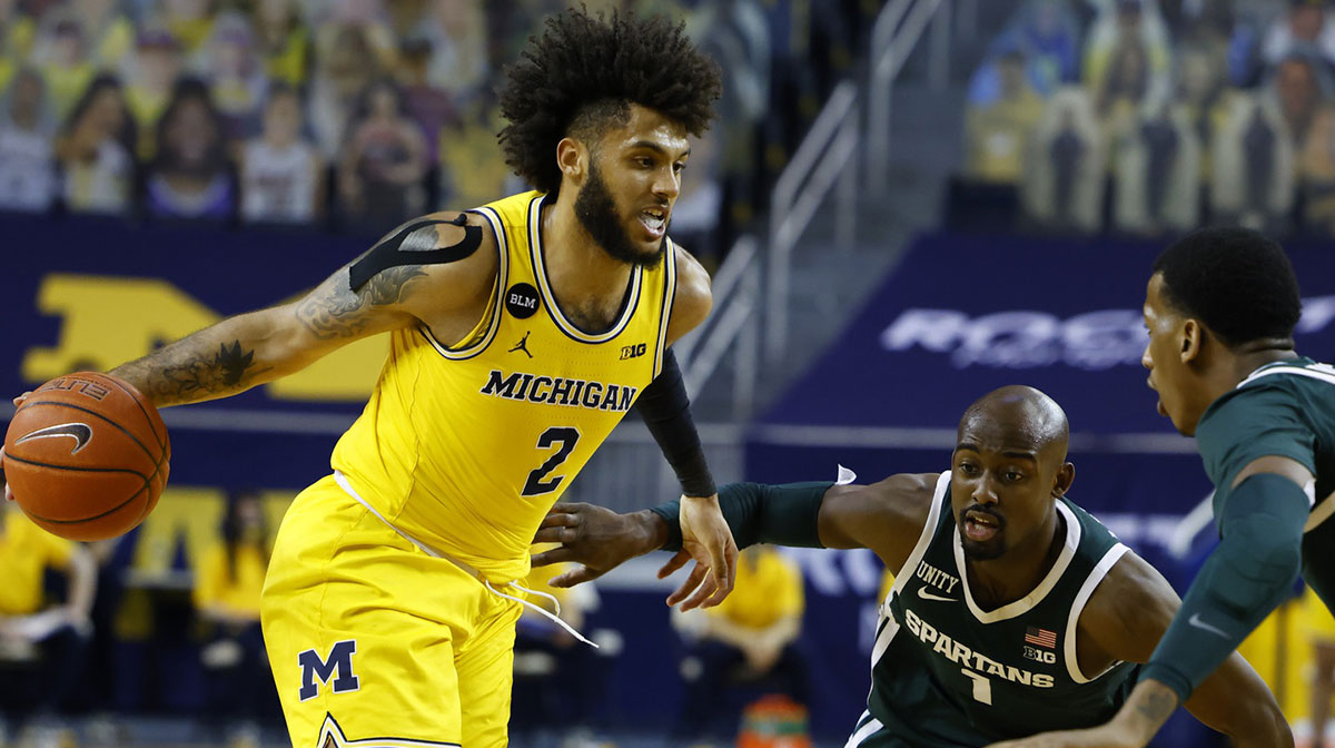 Michigan Wolverines forward Isaiah Livers (2) dribbles past Michigan State Spartans guard Joshua Langford (1) in the first half at Crisler Center.