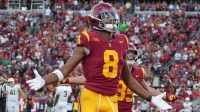 Southern California Trojans wide receiver Ja'Kobi Lane (8) celebrates after scoring on a 6-yard touchdown reception against the Notre Dame Fighting Irish in the second half at United Airlines Field at Los Angeles Memorial Coliseum.