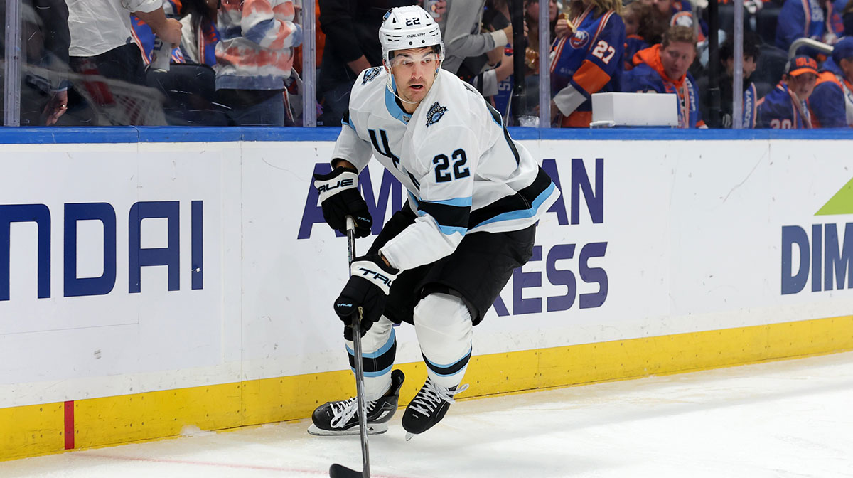 Utah Hockey Club center Jack McBain (22) skates with the puck against the New York Islanders during the third period at UBS Arena.