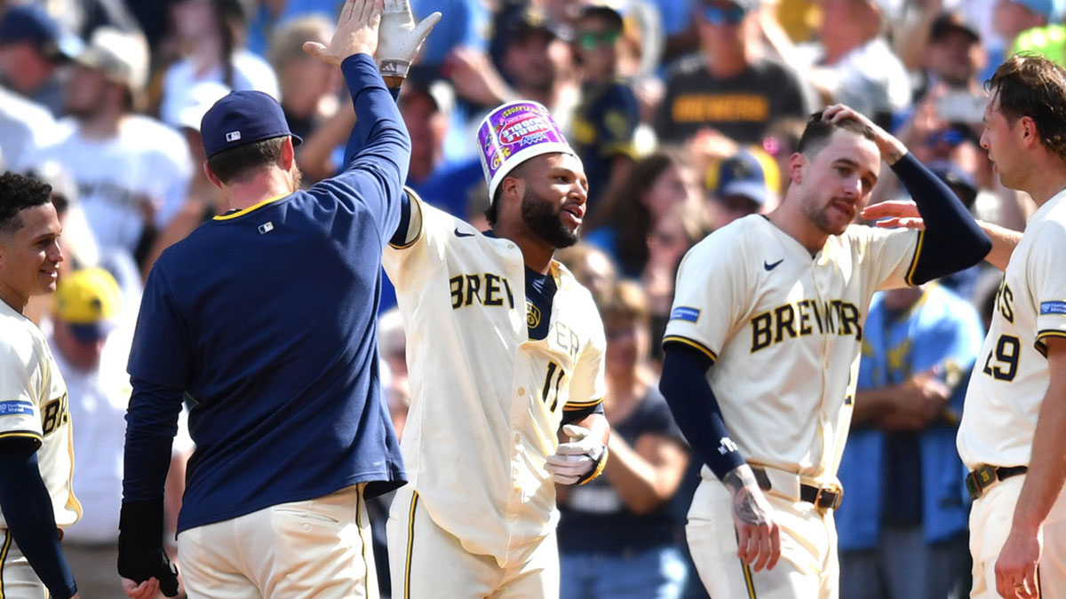 The Milwaukee Brewers celebrate a walk-off single by center fielder Jackson Chourio during the tenth inning against the Los Angeles Dodgers at American Family Field.