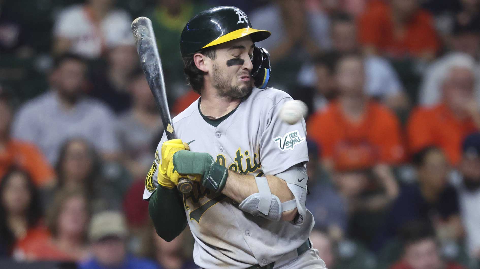 Athletics shortstop Jacob Wilson (5) reacts to an inside pitch during the sixth inning against the Houston Astros at Daikin Park