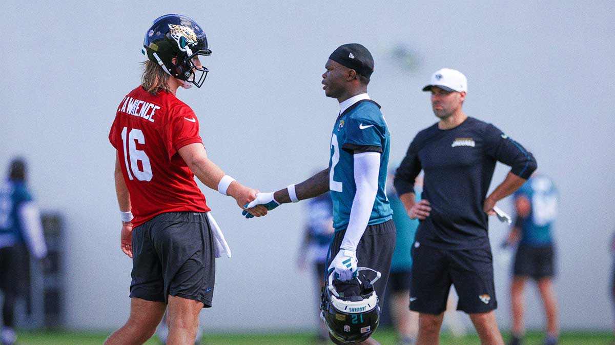 Jacksonville Jaguars quarterback Trevor Lawrence (16) and wide receiver Travis Hunter (12) participate in training camp at Miller Electric Center.