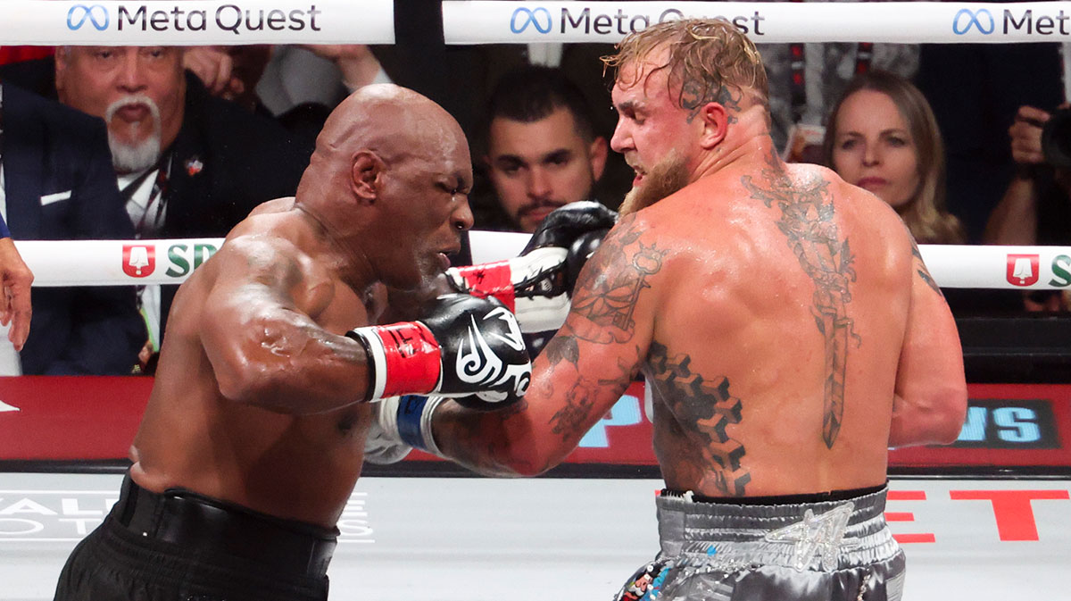 Mike Tyson (black gloves) fights Jake Paul (silver gloves) at AT&T Stadium.