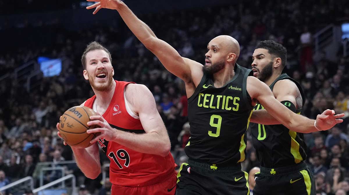 Boston Celtics guard Derrick White (9) defends Toronto Raptors center Jakob Poeltl (19) during the second half at Scotiabank Arena.