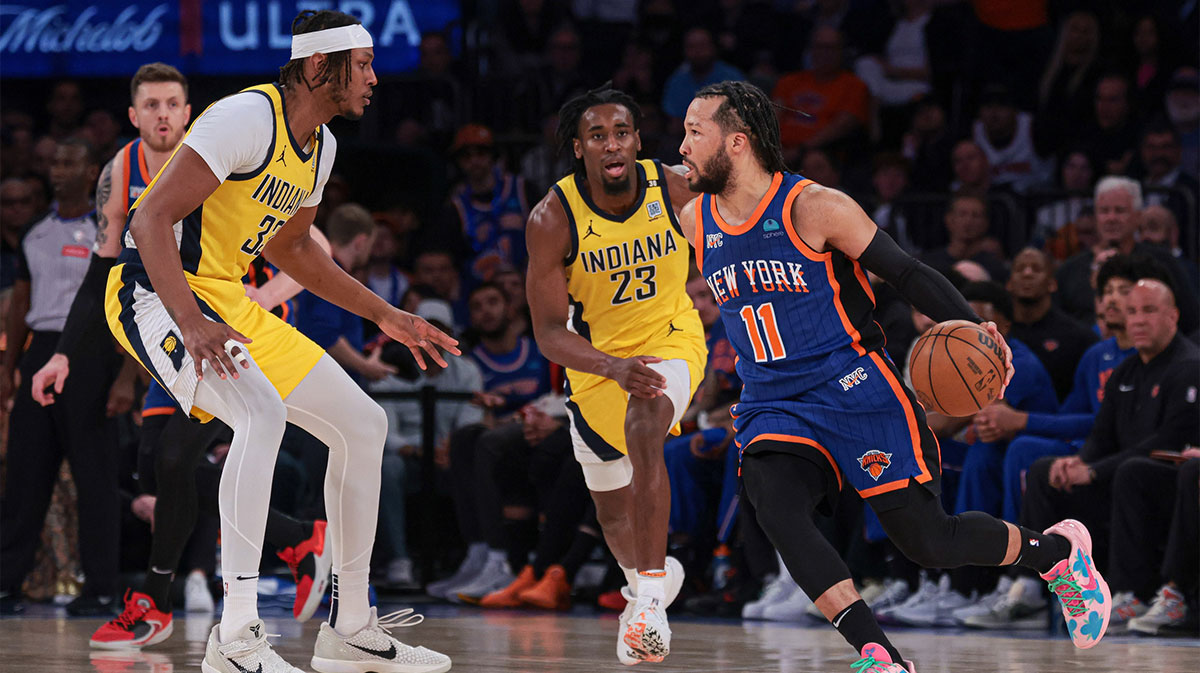 New York Knicks guard Jalen Brunson (11) dribbles against Indiana Pacers forward Aaron Nesmith (23) and center Myles Turner (33) during the first half during game five of the second round for the 2024 NBA playoffs at Madison Square Garden.