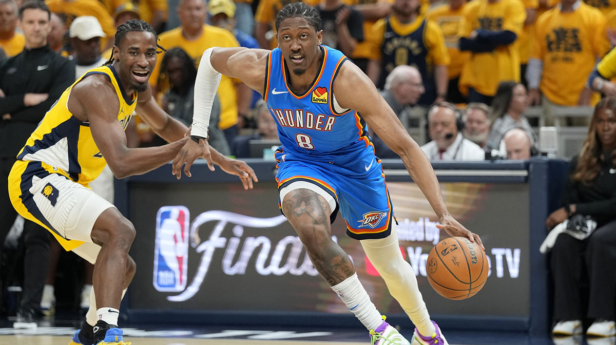 Oklahoma City Thunder forward Jalen Williams (8) drives to the basket against IIndiana Pacers forward Aaron Nesmith (23) during the first half of game six of the 2025 NBA Finals between the Oklahoma City Thunder and the Indiana Pacers at Gainbridge Fieldhouse.