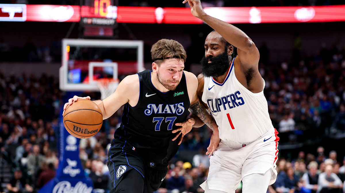 Dallas Mavericks guard Luka Doncic (77) drives to the basket as LA Clippers guard James Harden (1) defends during the first quarter at American Airlines Center.