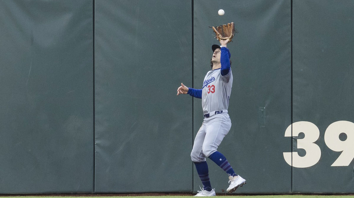 Los Angeles Dodgers center fielder James Outman (33) catches a deep fly ball against the San Francisco Giants during the fifth inning at Oracle Park.
