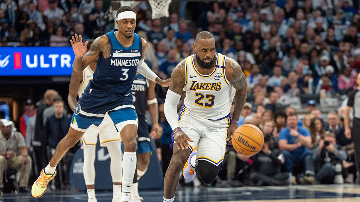 Los Angeles Lakers forward LeBron James (23) chases the ball as a result of the defense of Minnesota Timberwolves forward Jaden McDaniels (3) in the third quarter during game four of first round for the 2025 NBA Playoffs at Target Center.
